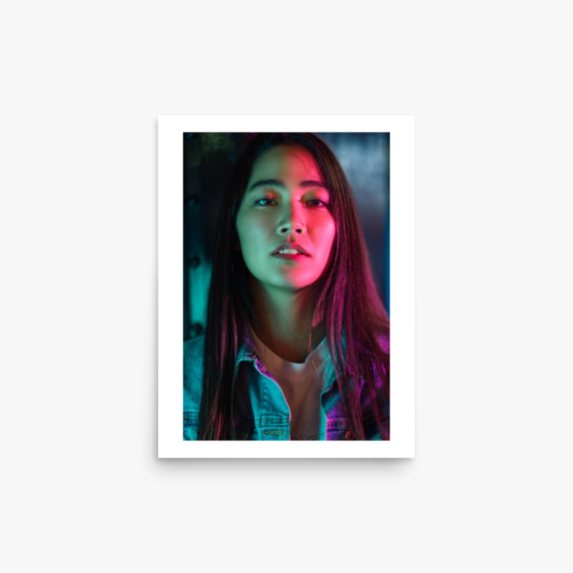 Portrait of young woman lit by colorful neon lights at night 12x16 in Poster