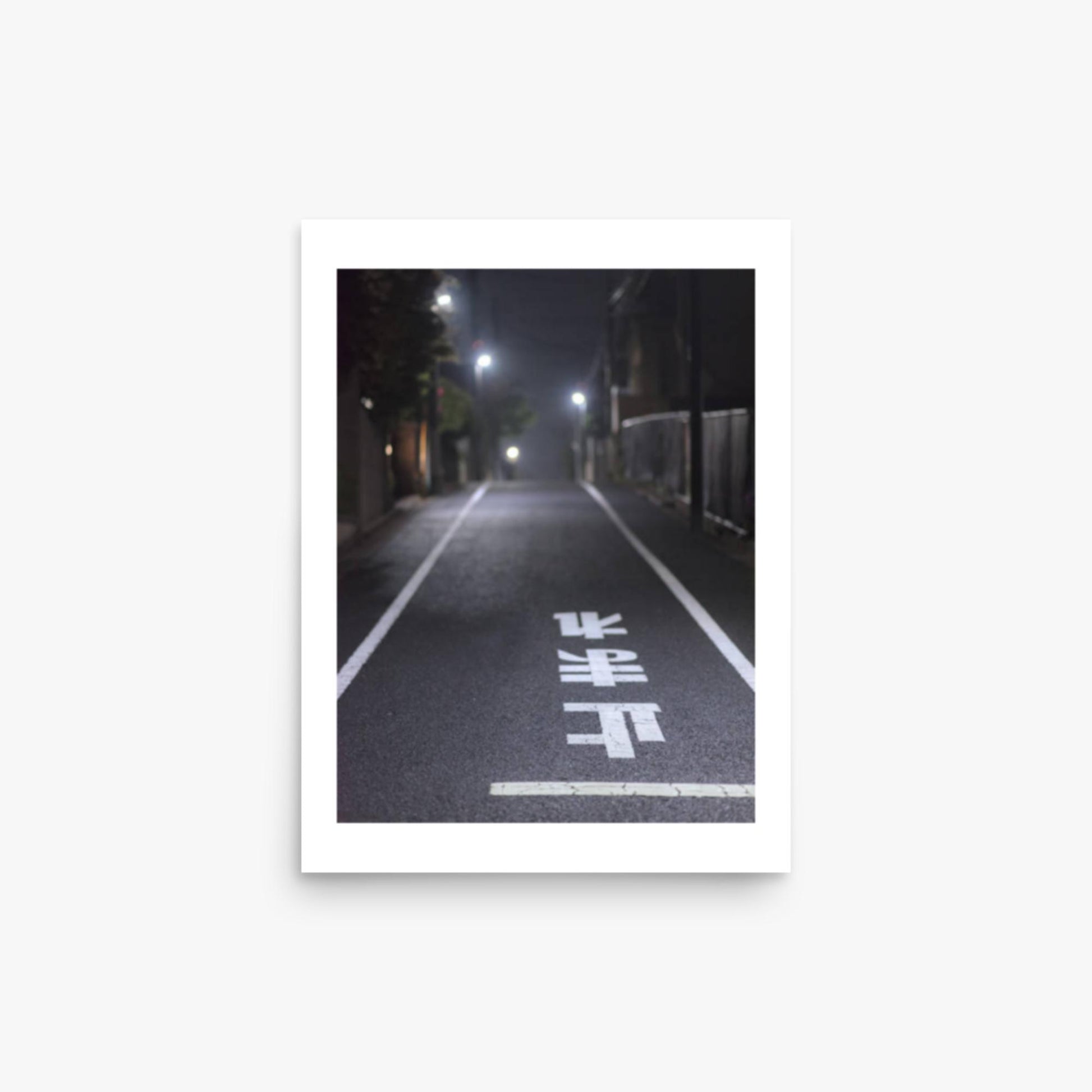 Typical road by night with the stop sign in Japanese written on the ground 12x16 in Poster